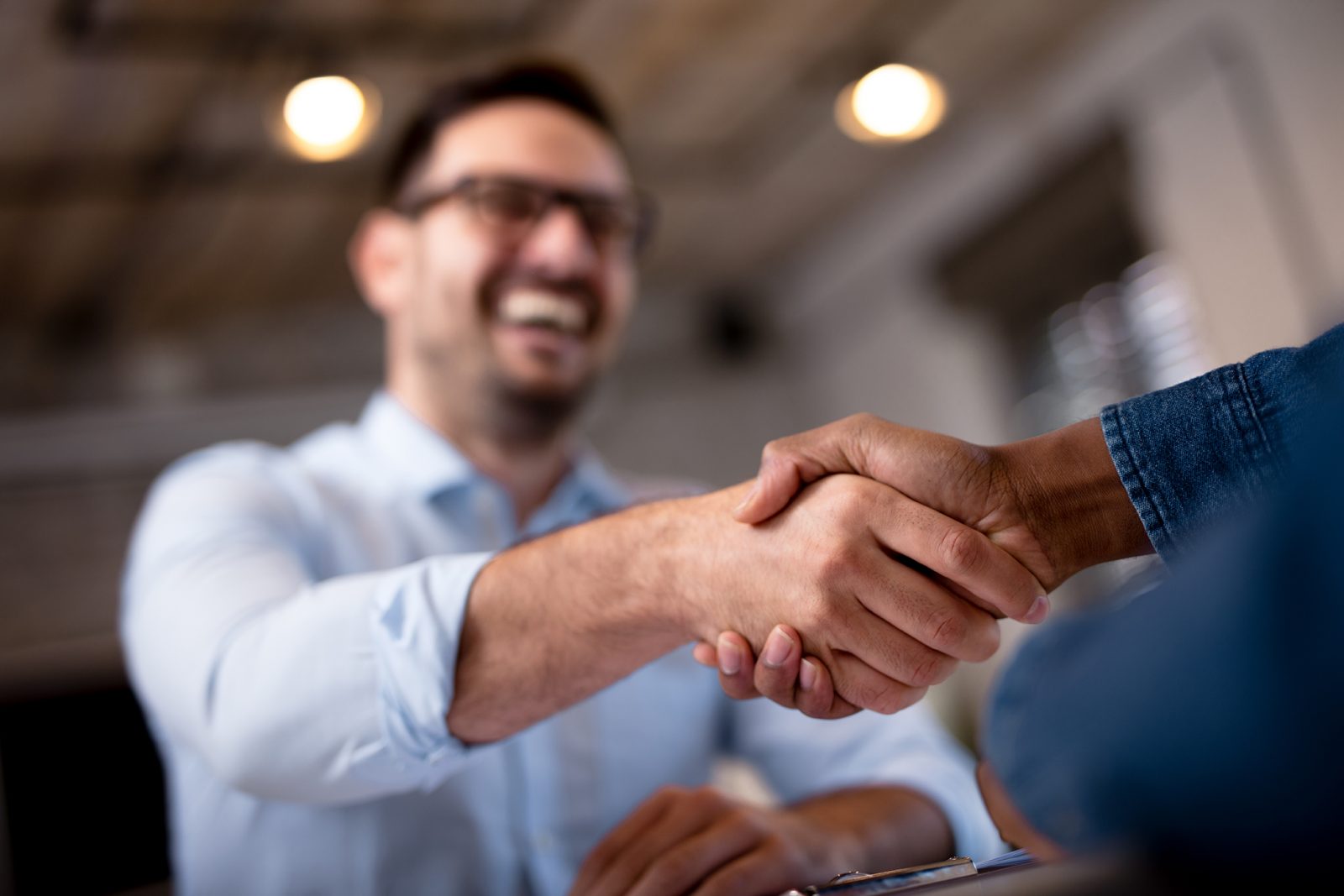 Business partners shaking hands in agreement