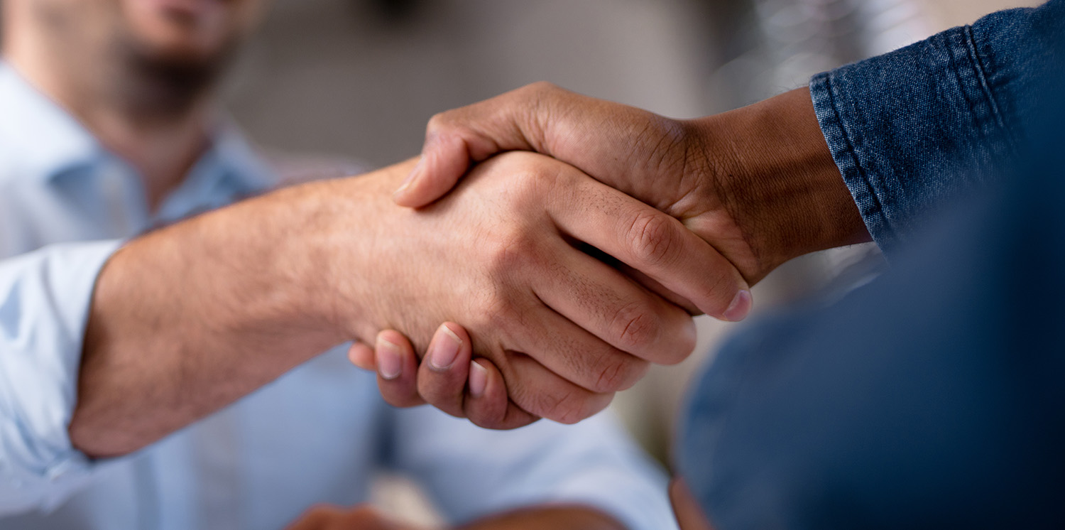Business partners shaking hands.