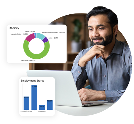 Man looking at laptop with graphs